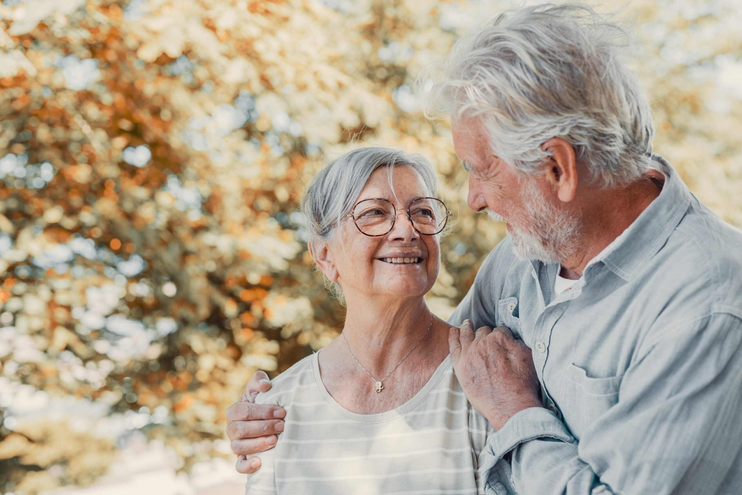 Elderly couple supporting each other as one needs memory care