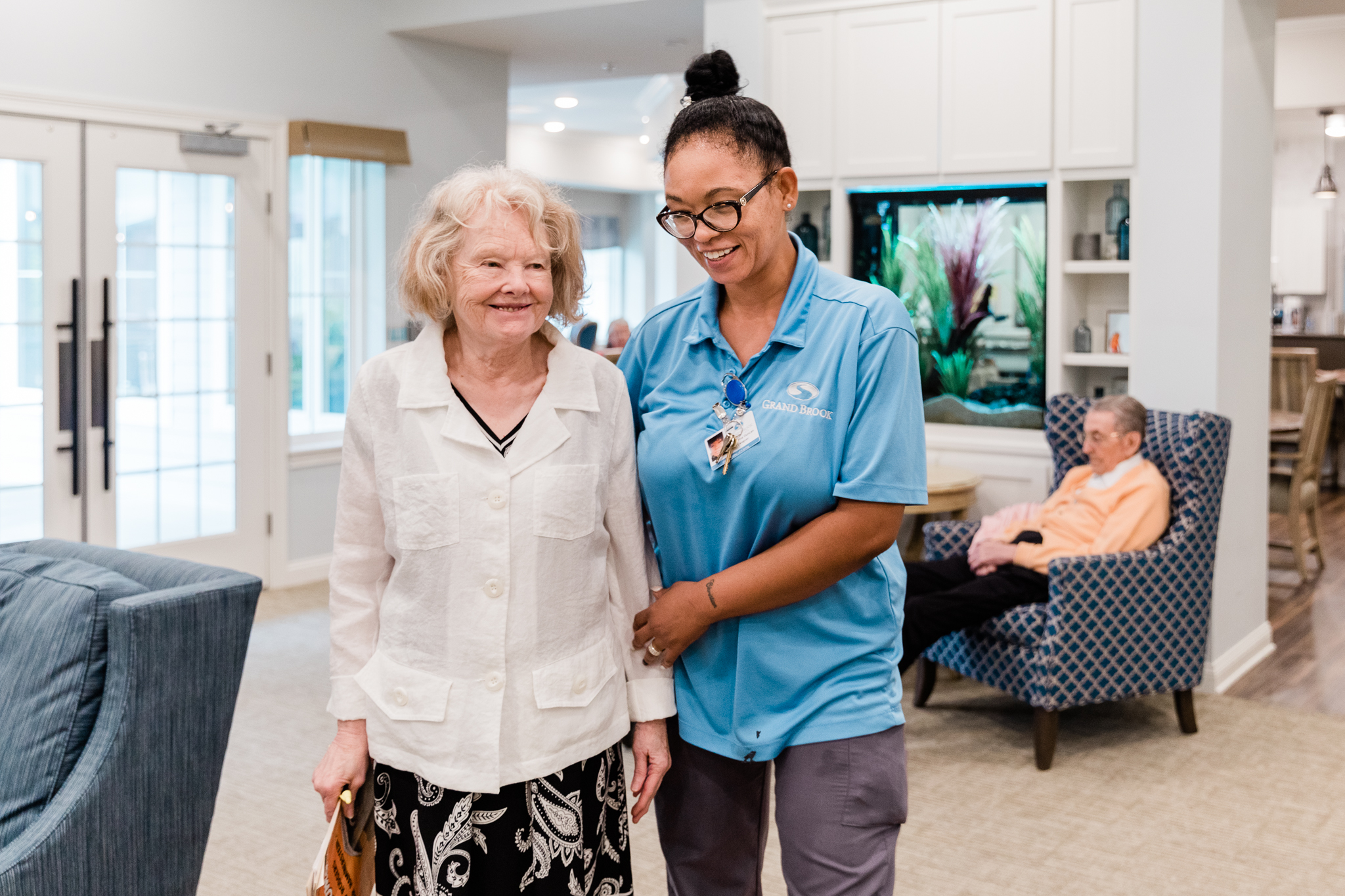 Care taker with resident at Grand Brook Memory Care of Fishers