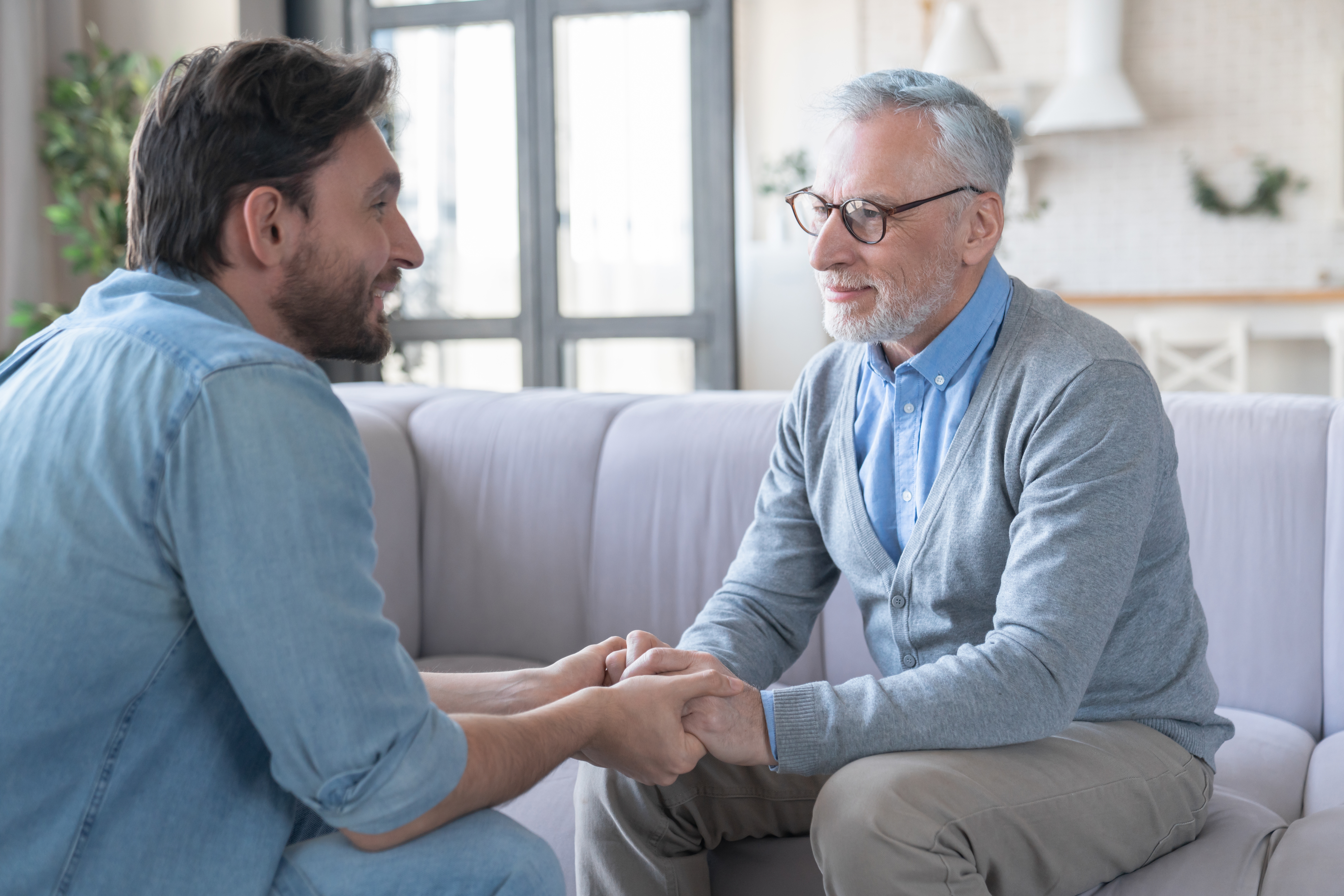Son talking to his old parent above moving to memory care