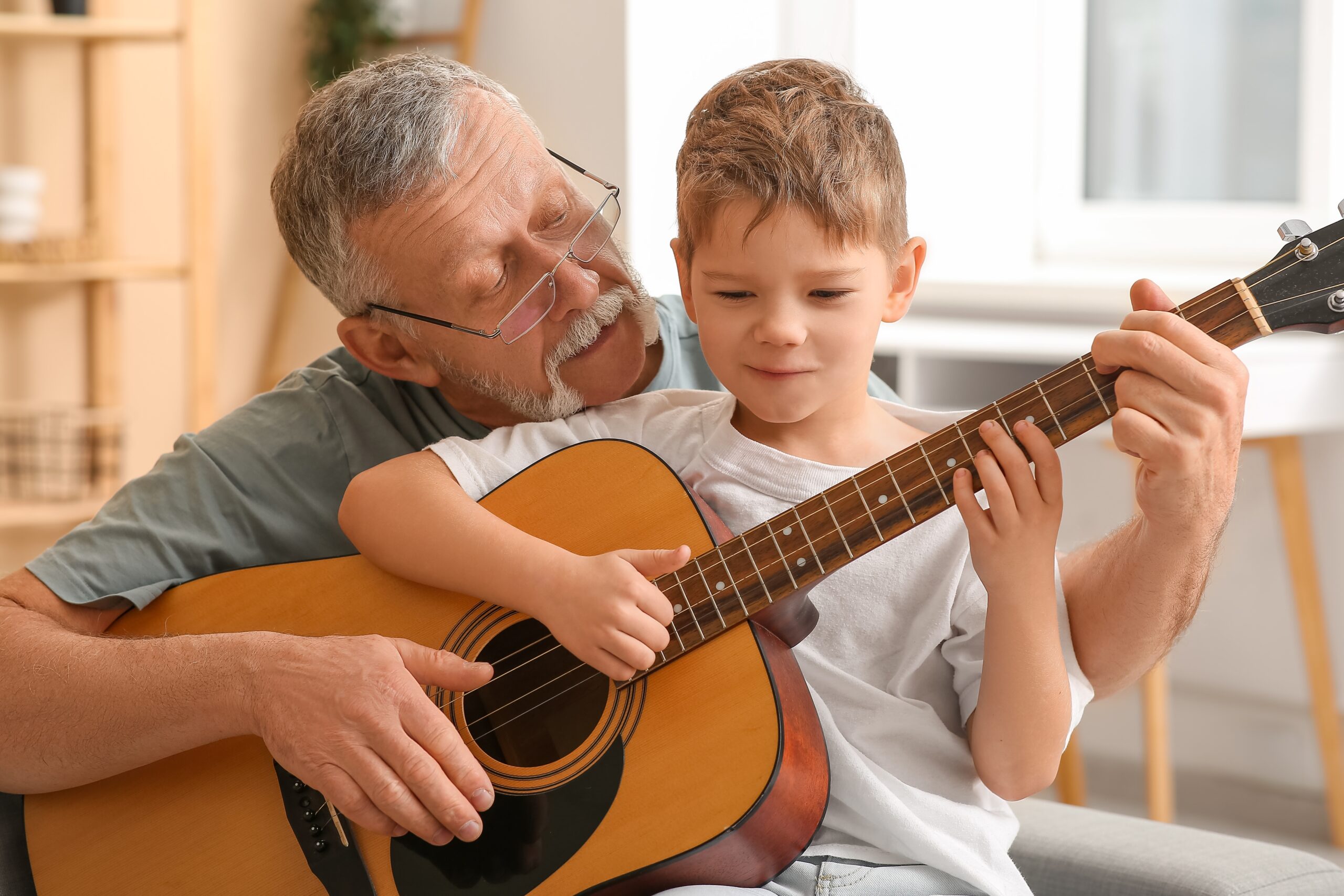 Grandfather who has dementia and is in memory care with his grandson.