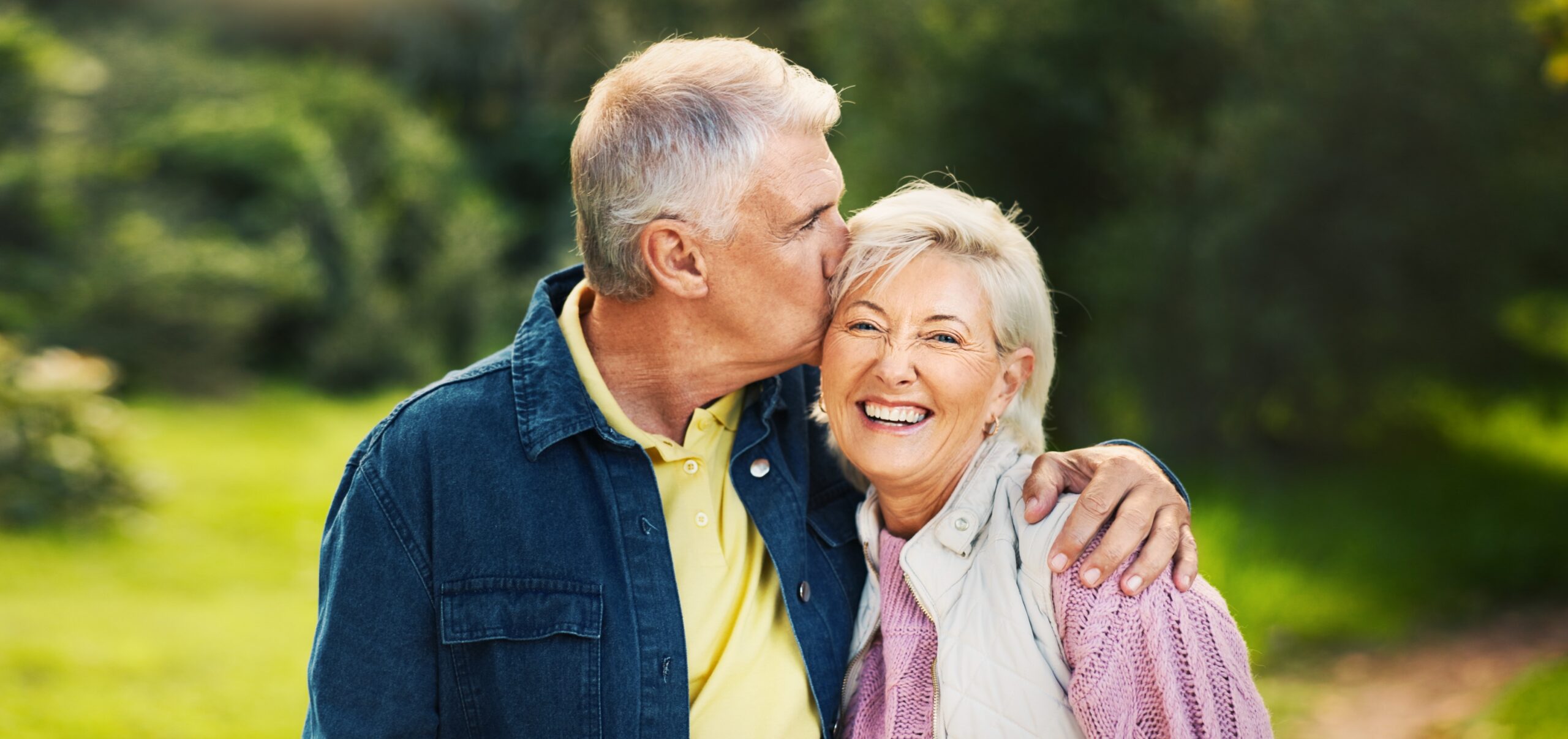 Happy senior couple at home, representing compassionate memory care at Grand Brook Memory Care.